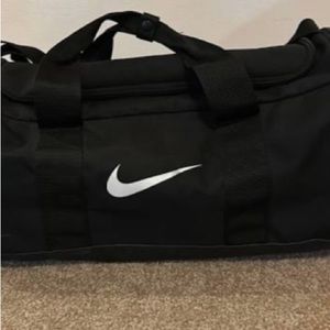 Used Nike large duffel bag black and white light wear
